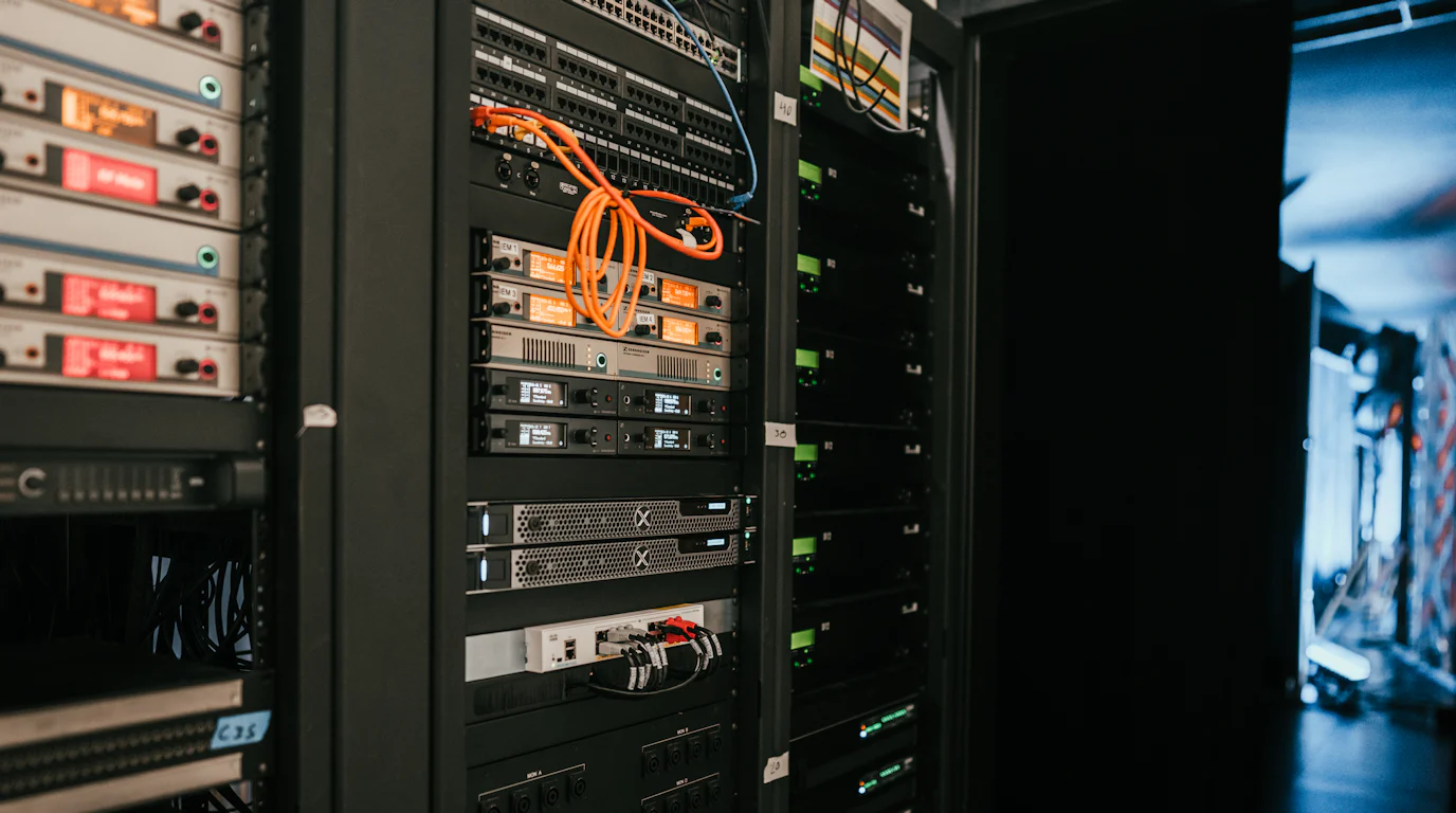 Rack of servers and network equipment in a server room