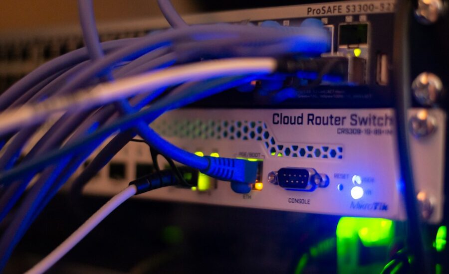 Network equipment with ethernet cables connected, the kind of hardware a firewall protects